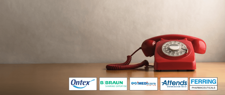 red retro telephone with company supporter logos underneath