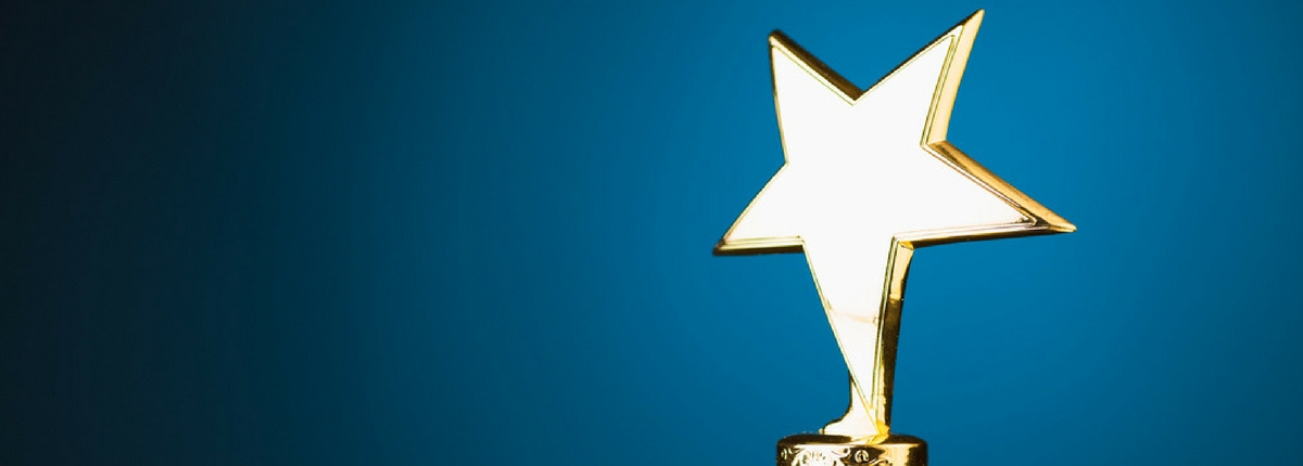 golden star trophy award with blue background