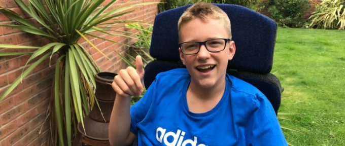 ben sat in his garden with his thumb up