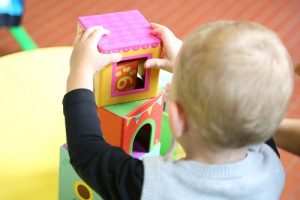 todder playing with soft building blocks