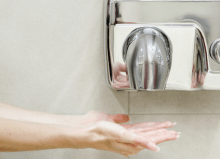 hands underneath hand dryer