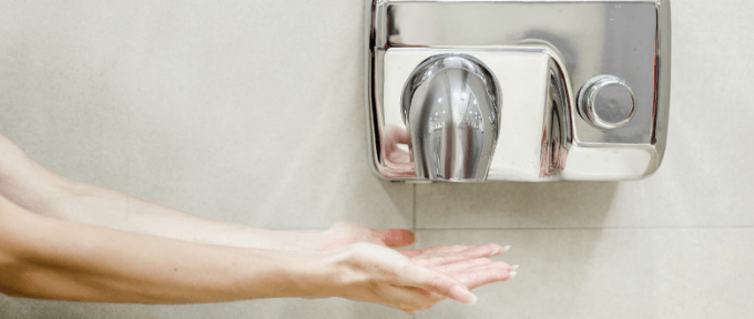 hands underneath hand dryer