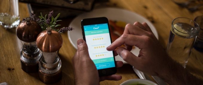 cleen app on mobile phone in hand