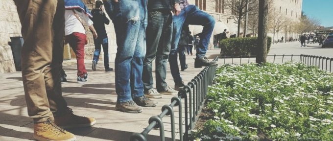 group of men wearing shoes and trainers