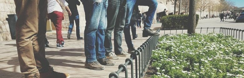 group of men wearing shoes and trainers