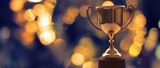gold trophy with blurred spotlight background