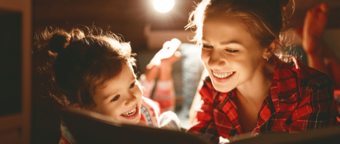 mother and daughter reading a book