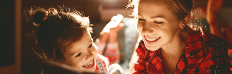 mother and daughter reading a book