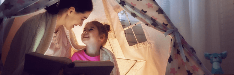 mum reading book to daughter for national read a book day