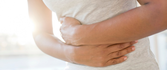 Woman holding stomach