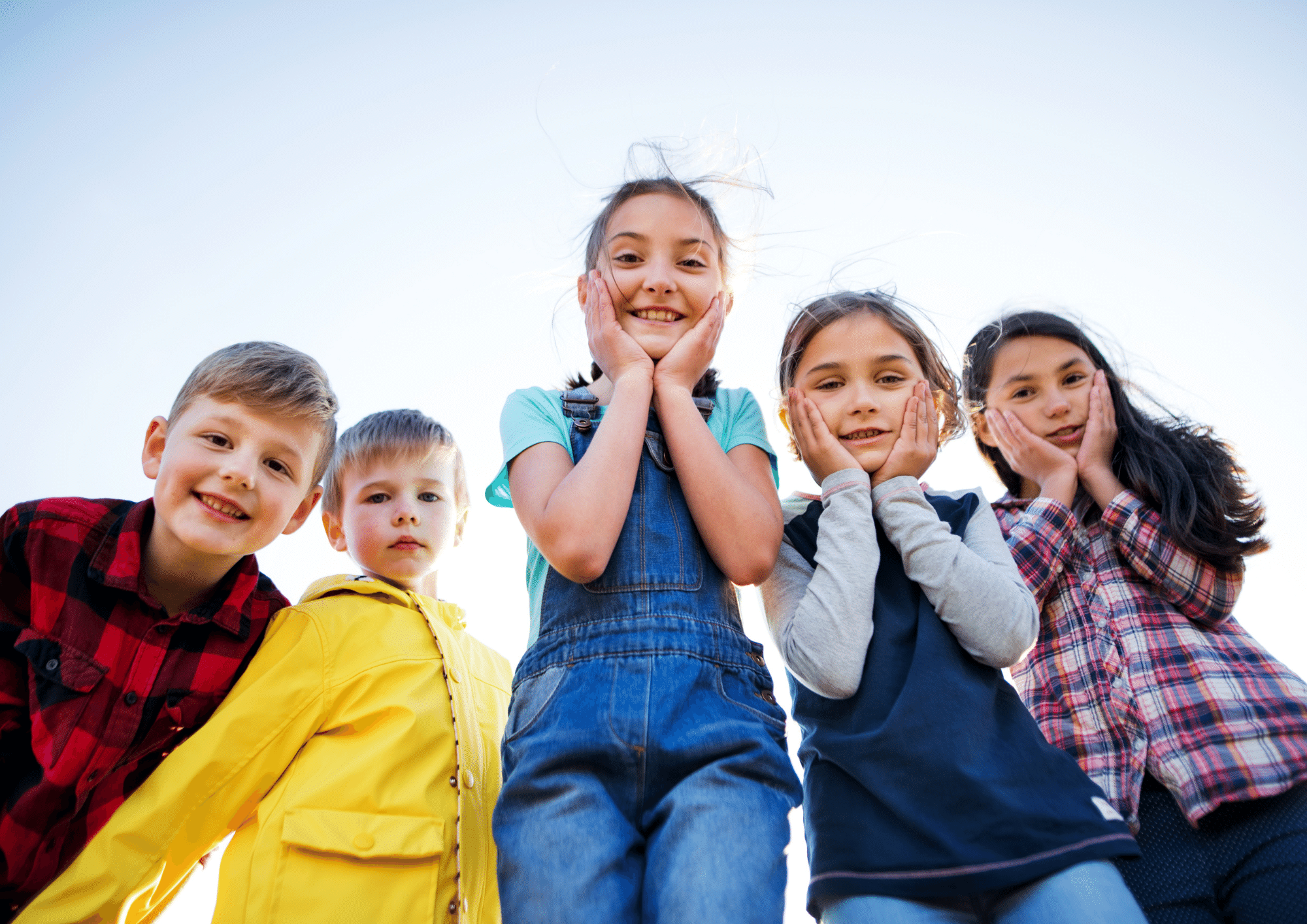 Young children looking into the camera for talking about bedwetting