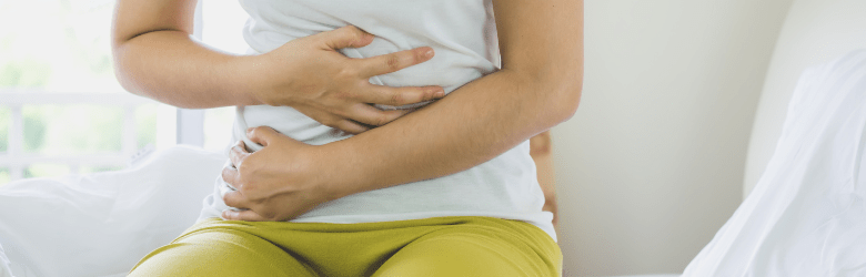 woman holding her stomach